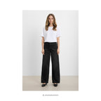 Løse denim bukser i washed black OEKO-TEX® bomuld – styling forslag - Et Sanset Univers