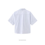 Elene skjortebluse i Off-white bagfra – et delikat snit i bløde linjer, let som en sommerdag mod huden