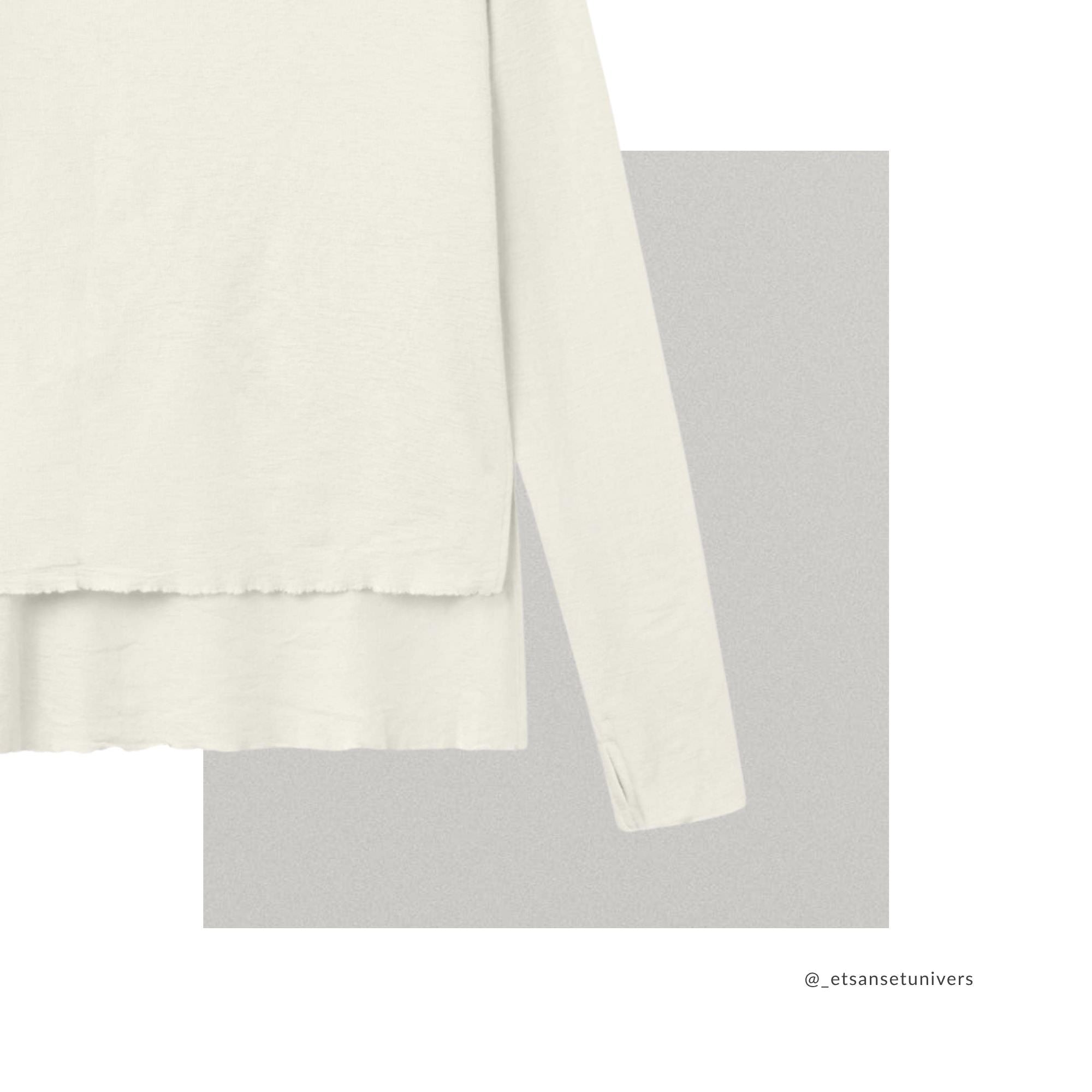 Merinould OEKO-TEX® bluse med høj slids i raw white – close up ærme og slids - Et Sanset Univers