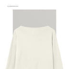 Merinould OEKO-TEX® bluse med høj slids i raw white – close up hals - Et Sanset Univers
