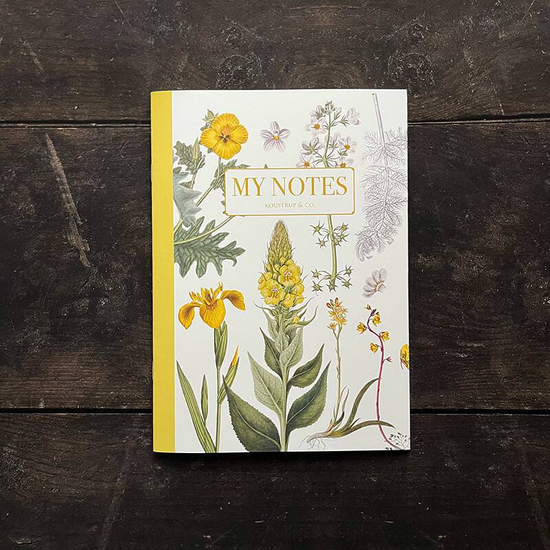 Noteshæfte med gult blomstermotiv – stiliseret - Et Sanset Univers
